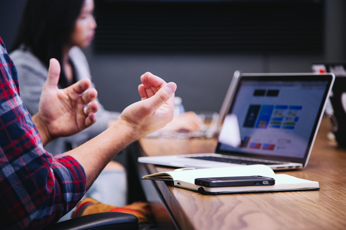 Professional team discussion around data screens